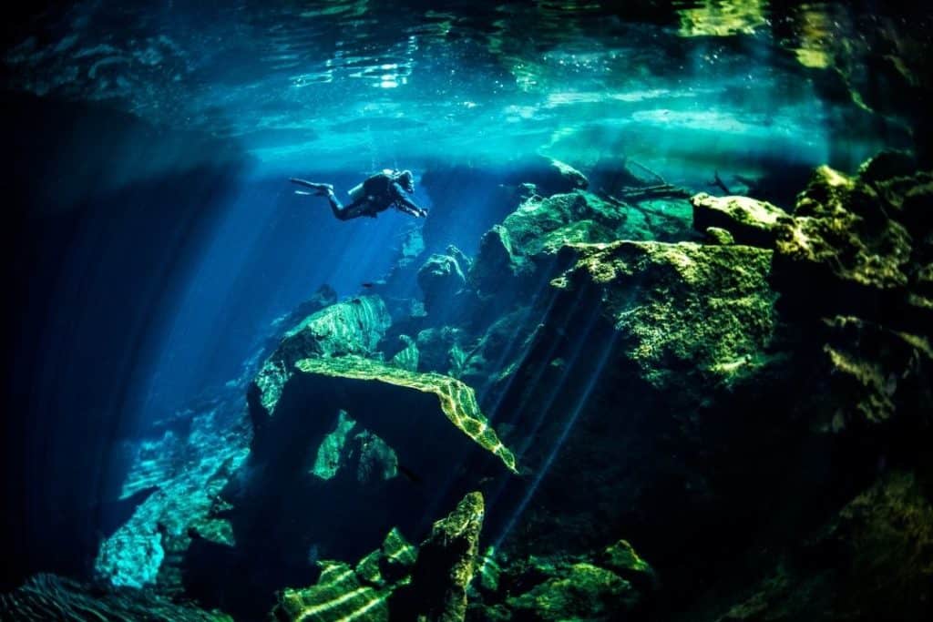 scuba diver in a yucatan underwater cenote