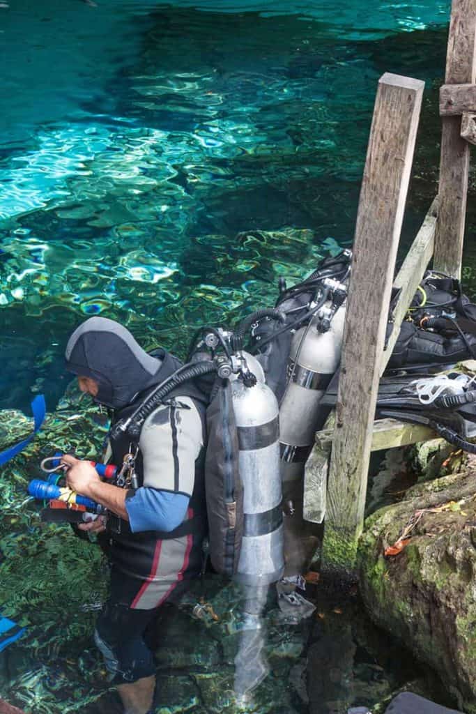diver preparing to enter a cenote