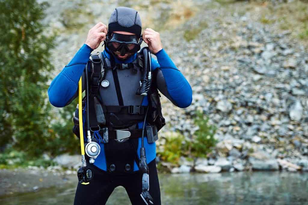 scuba diver wearing a two piece wetsuit