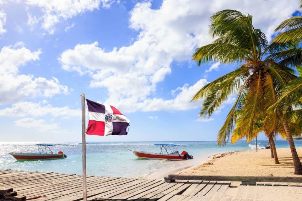 dominican republic beach with a flag
