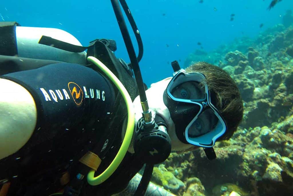 diver lost underwater with a surprise expression