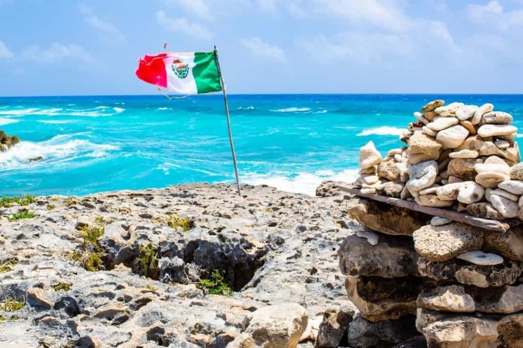 mexican flag on a cozumel island beach