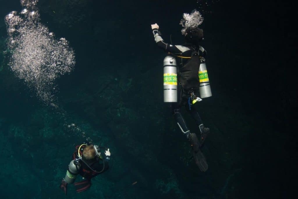 nitrox technical divers with sidemount tanks