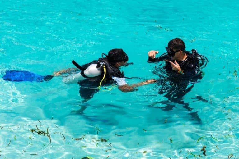 padi instructor and his student in a swimming pool