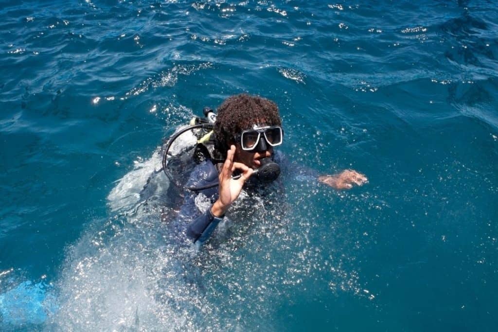 diver at the surface making a ok sign